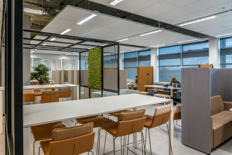 an office that has a long table and chairs in it