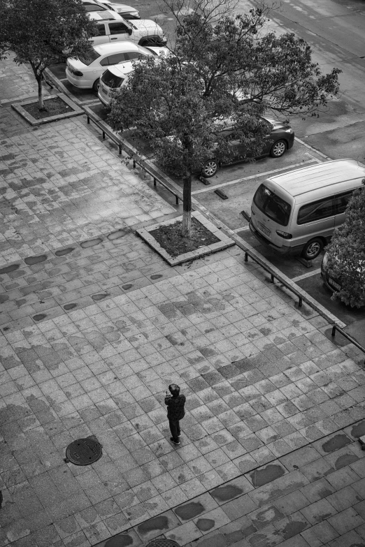 the car park has many cars parked on the side