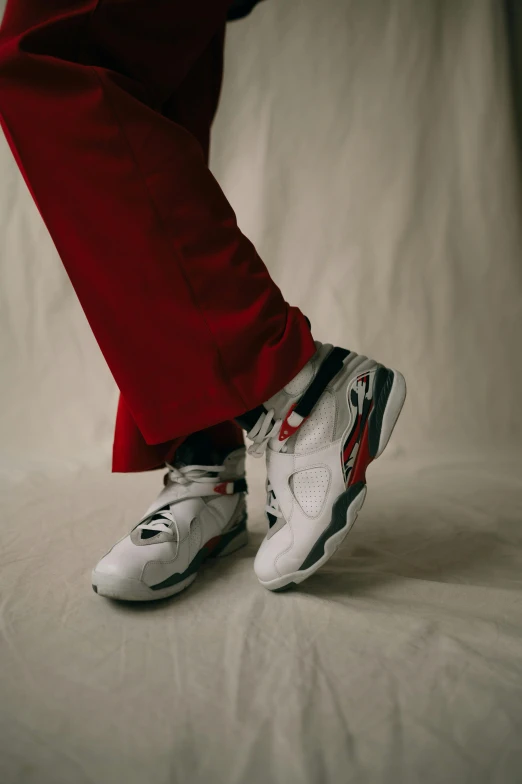 an image of a person's feet wearing sneakers