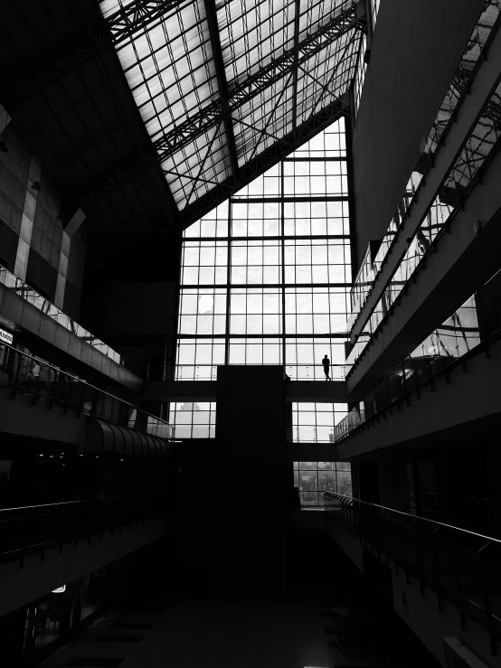 a tall building with lots of windows and bars on the ceiling