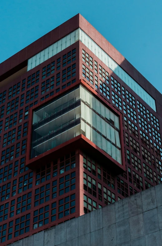 a very tall brick building with some windows on the side