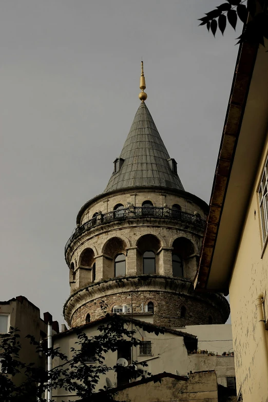 a building with a round roof with a clock on top