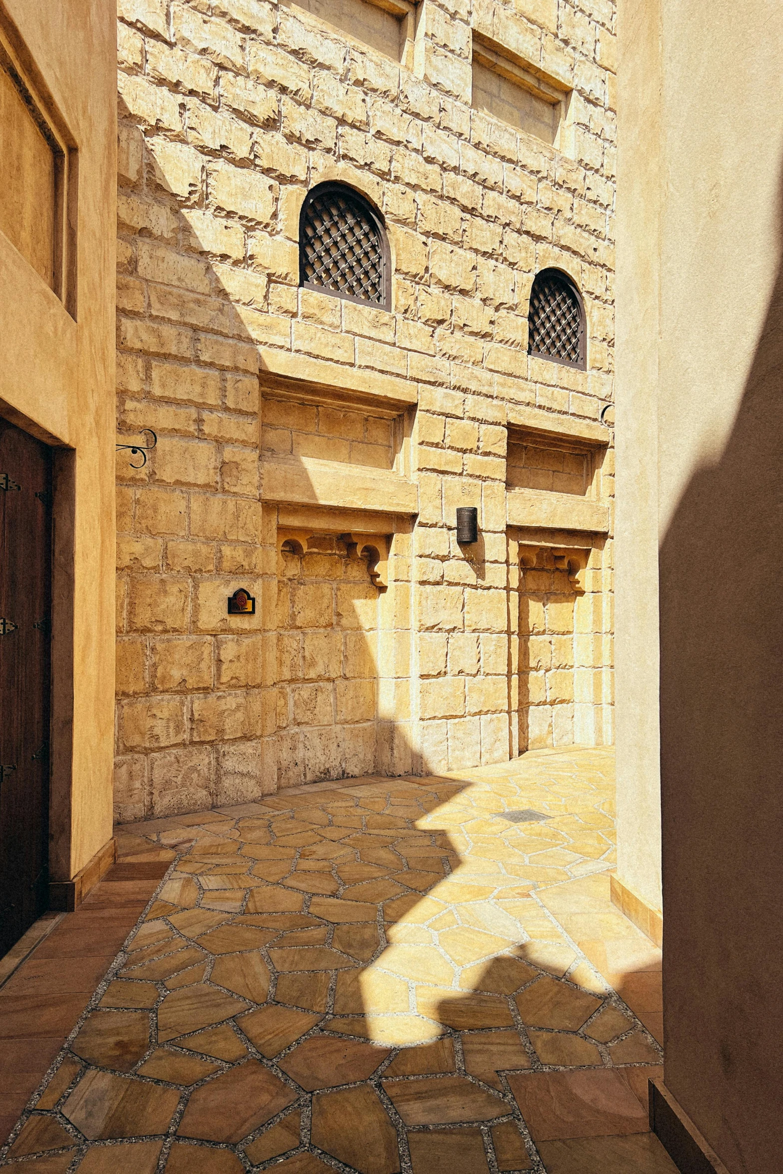 an empty street with some doors and windows