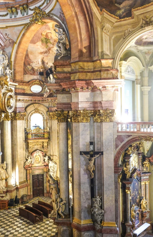 a church with a white and brown floor and a statue