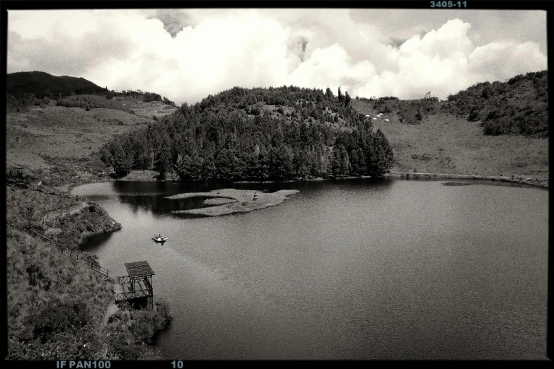 an aerial view of a mountain lake in black and white