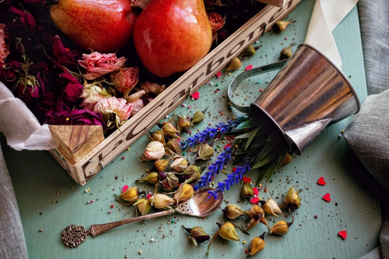 this is an image of a crate with flowers and apples