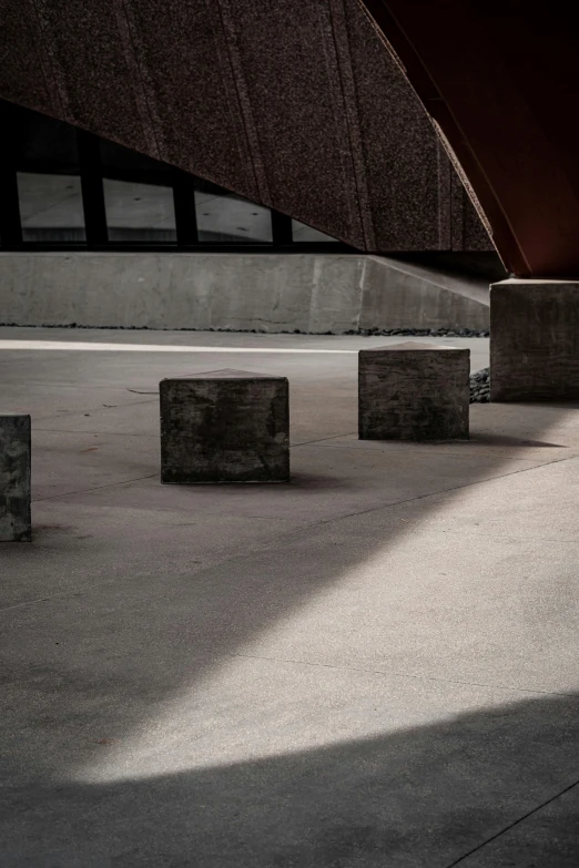 concrete blocks are placed along the side of the building