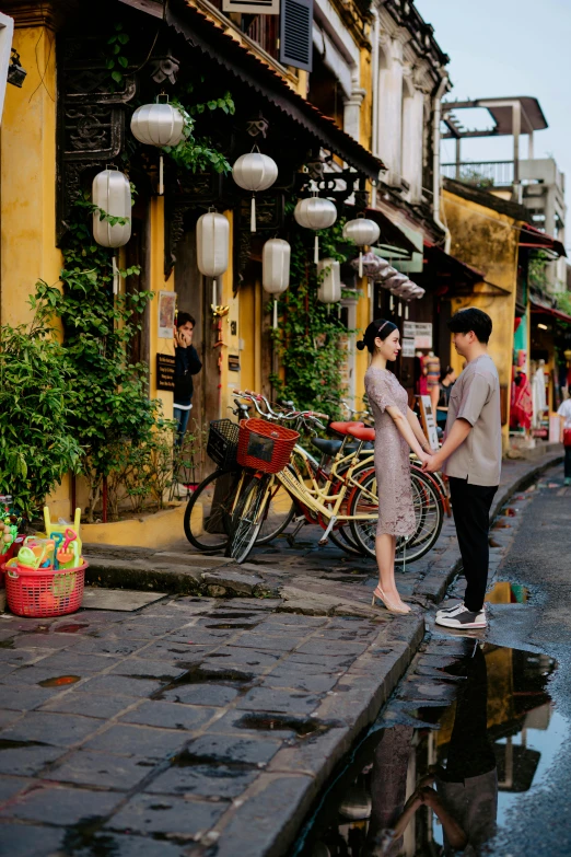 a couple is sharing a moment on the street