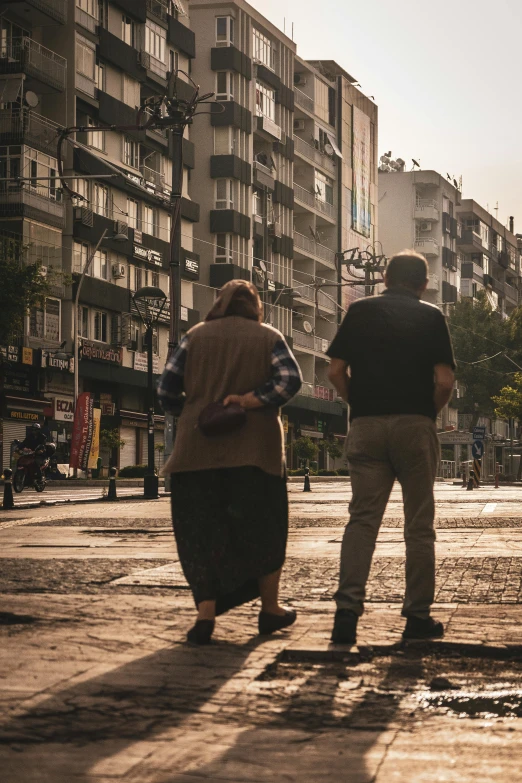 two people in a street and building buildings