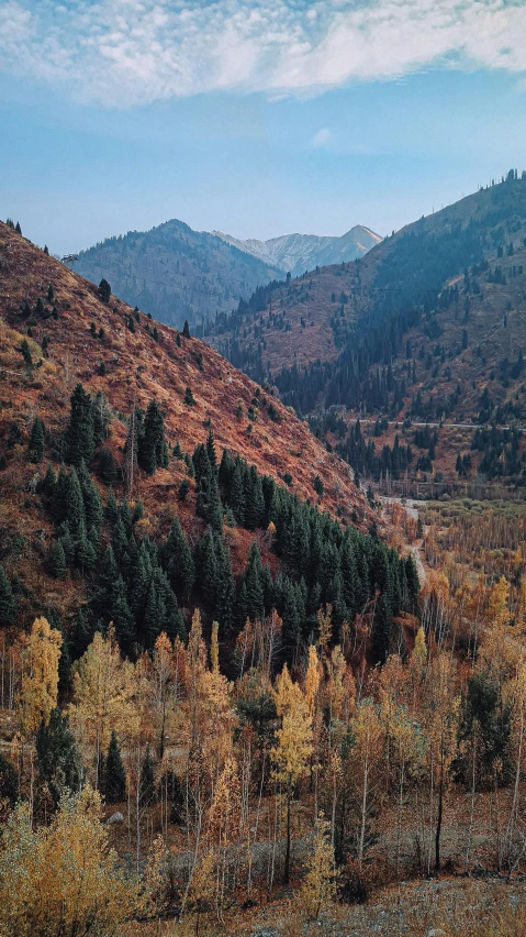 the mountains are shown in this autumn landscape