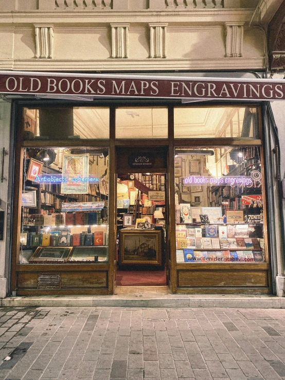 the outside of an old book shop on a sidewalk
