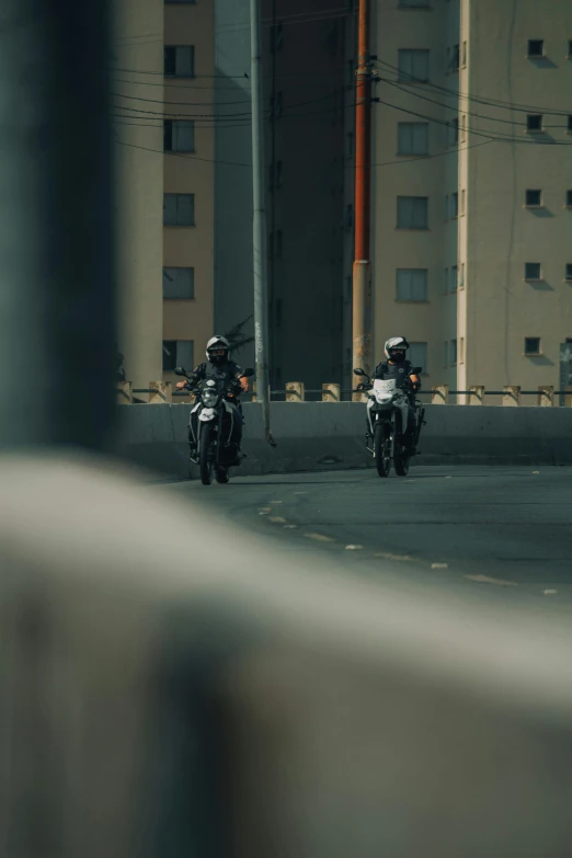 two people on motorcycles are riding in opposite directions