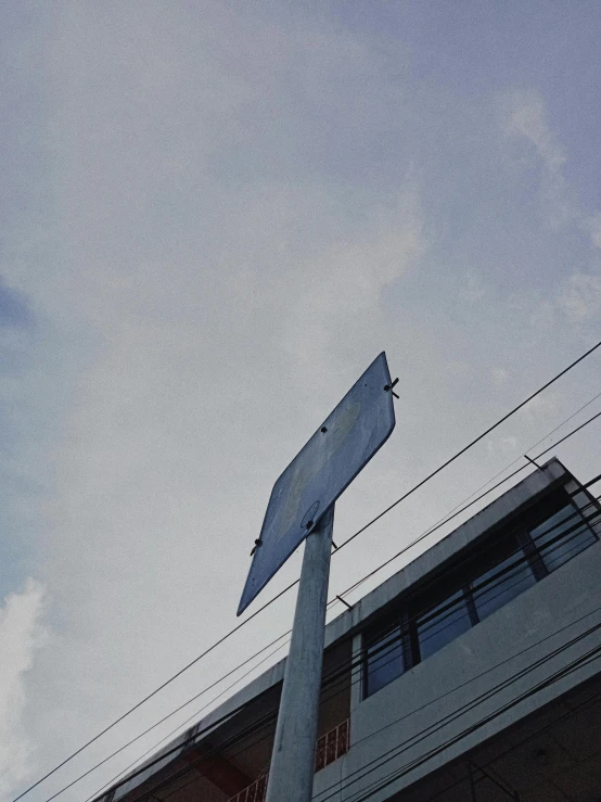 a street sign on top of a metal pole