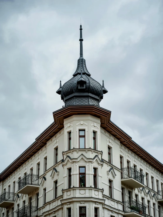 a white building has a tall tower on the top