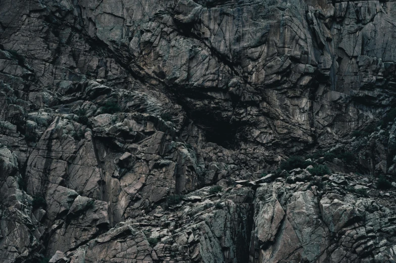 a mountain side with very large rocks that look like a face