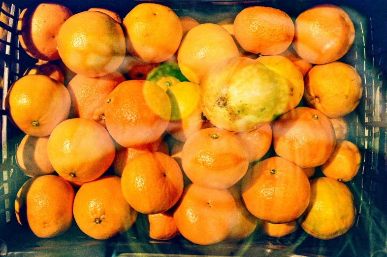 a close up of a basket full of oranges