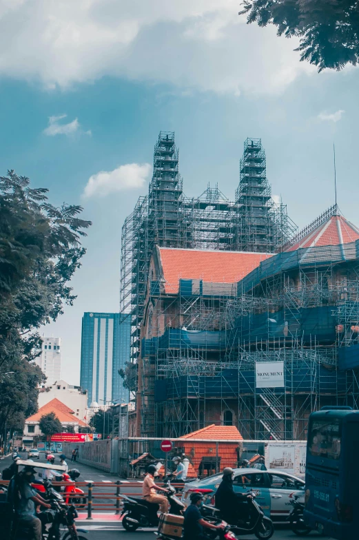 several scaffolding in front of several motorcycles and buildings