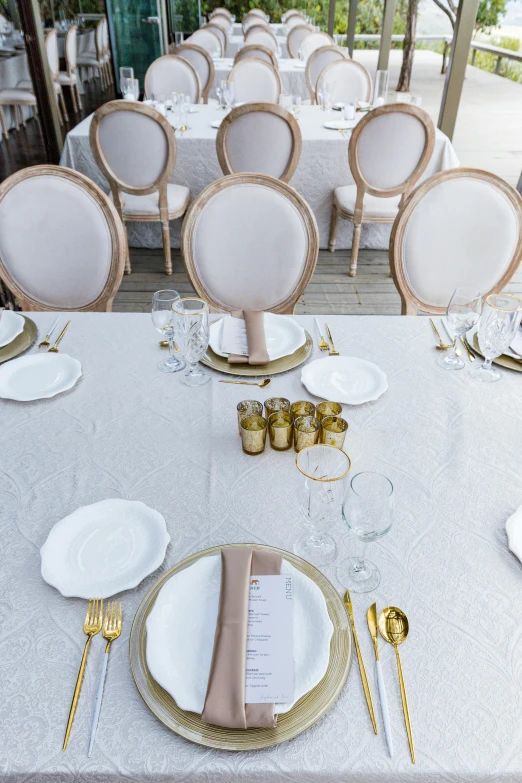 an empty table with a menu in between two plates