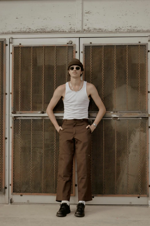 a woman standing in front of some metal bars