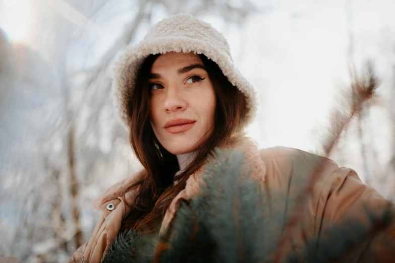 the young woman is wearing a white hat