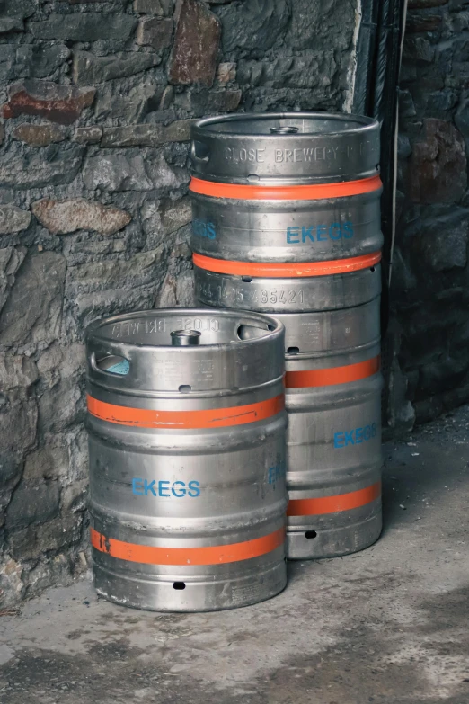 a close up of some metal barrels in a room