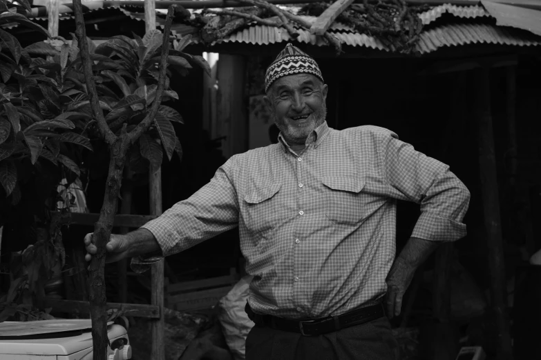 black and white image of a man in a hat