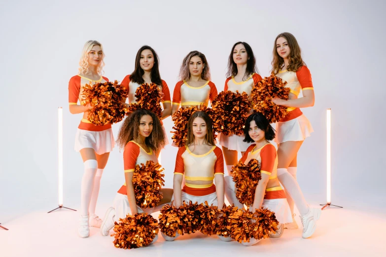 a group of young woman wearing cheerleader costumes