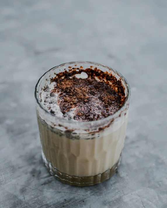 a beverage sits on the ice with sprinkles