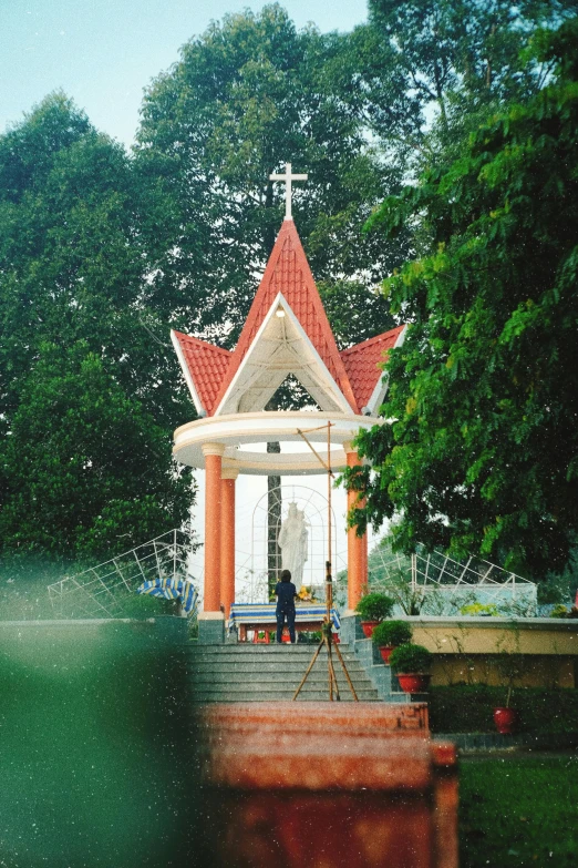 a small, ornate chapel stands on some steps