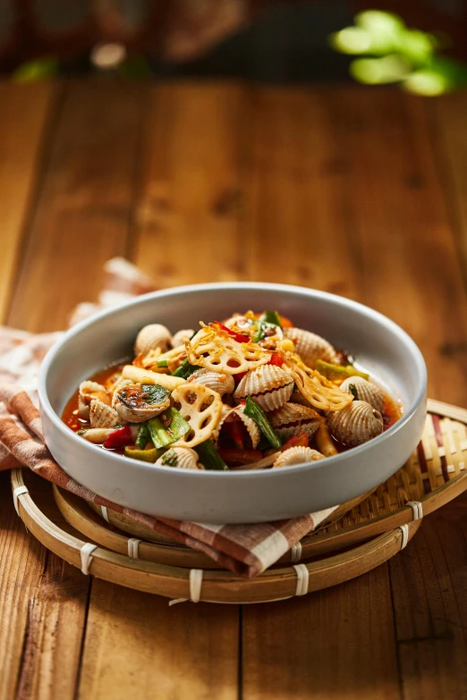 a white bowl filled with pasta and vegetables