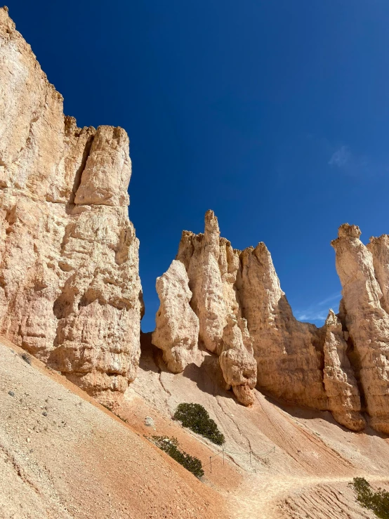 a rocky cliff is shown in the foreground