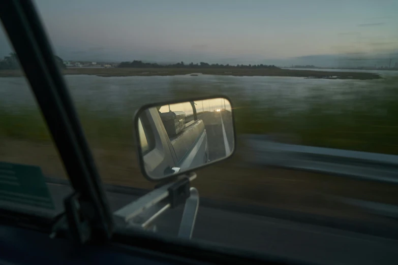 a view of the front mirror of a car from the side