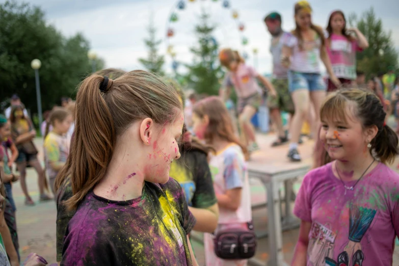 a group of s with faces smeared with colored powder