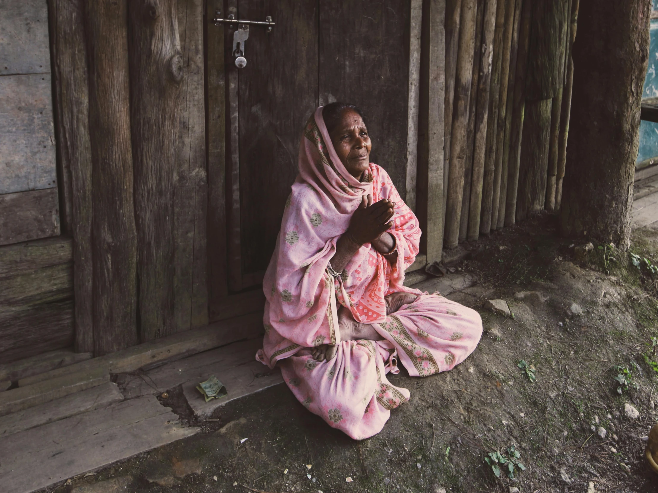 a woman is sitting down and looking out