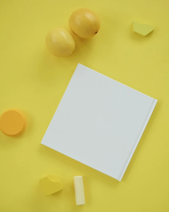 a blank paper surrounded by yellow and green pieces