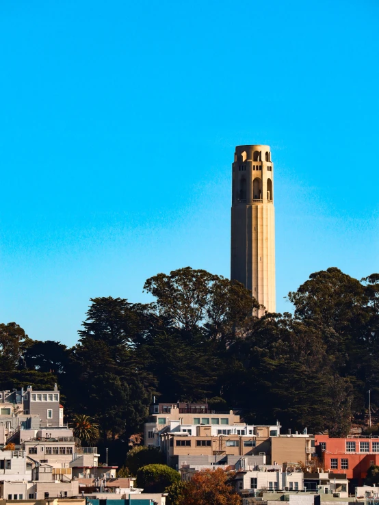 a tall clock tower towering over a city