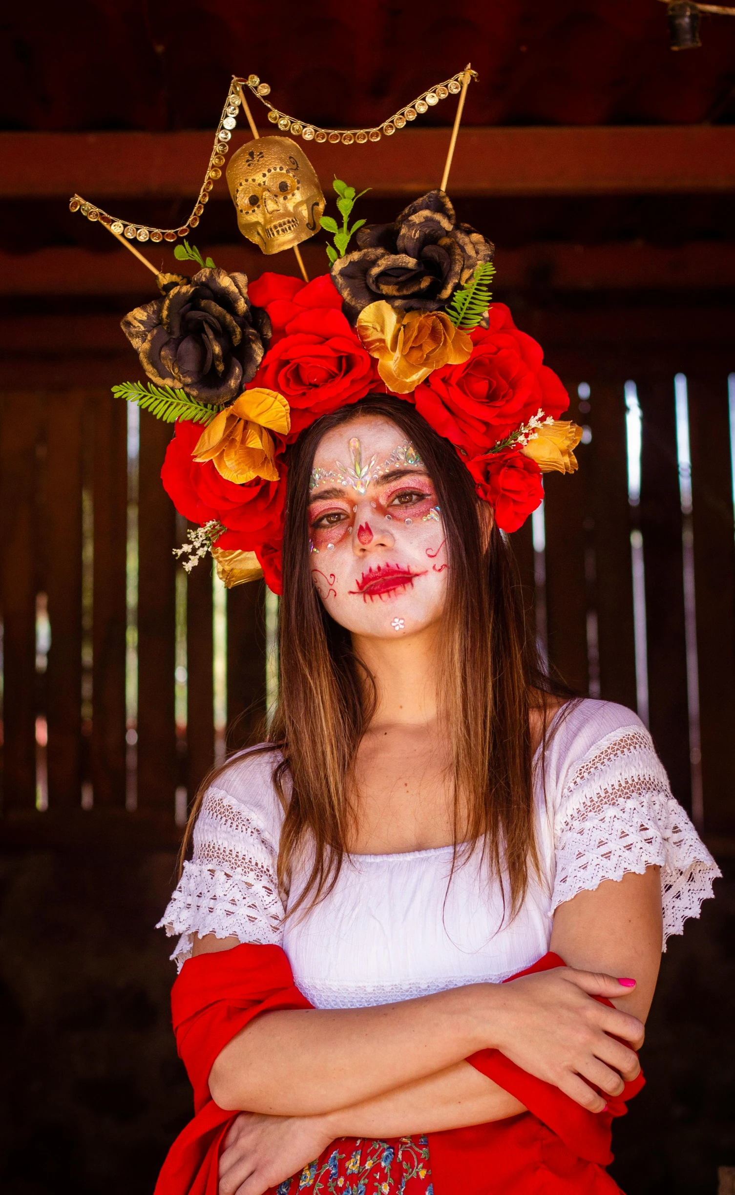 a woman wearing a flower crown and a red dress