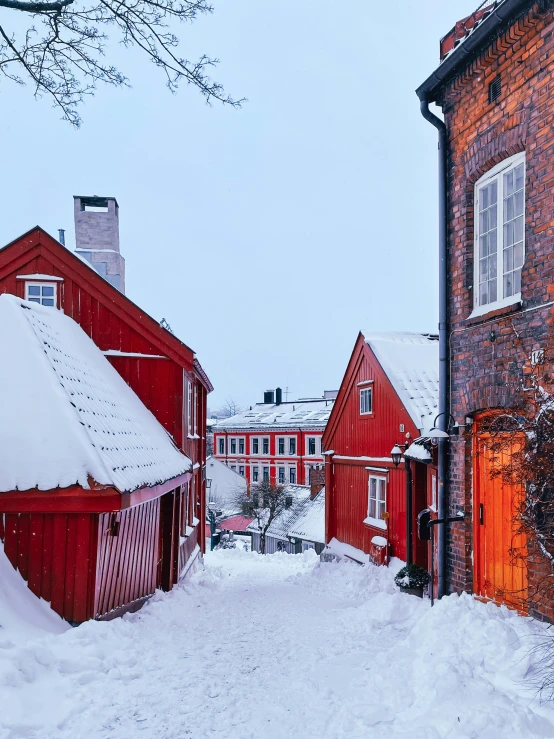 a road with a red building in the background