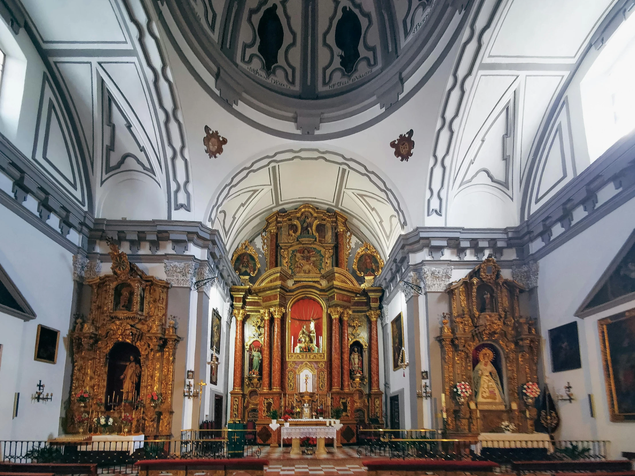 a church with a large alter and many windows