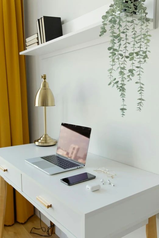 the laptop is left on top of the desk