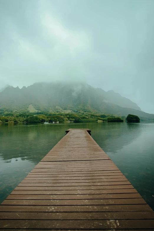 an empty dock sits in the middle of water