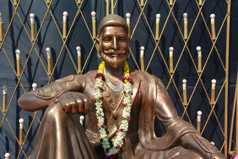 a statue of the god buddha with his hands clasped