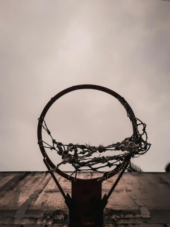 a basketball hoop on top of an old building