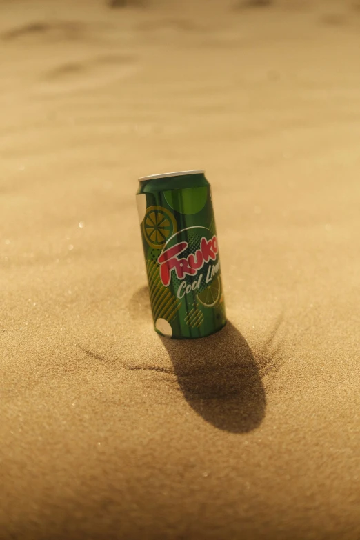 a can is in the sand on the beach