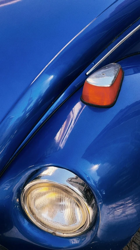 closeup of the grille on a vintage blue automobile