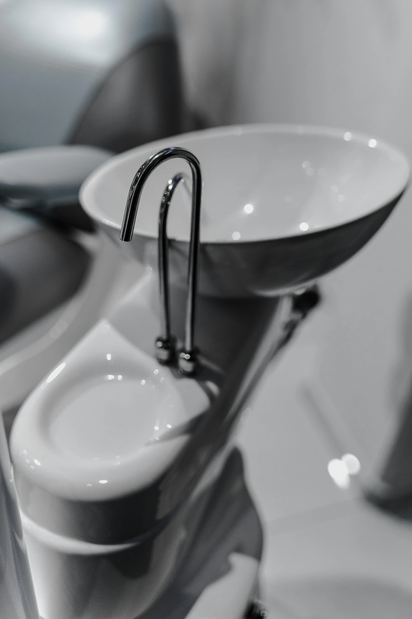 the sink has a chrome faucet in it's bowl