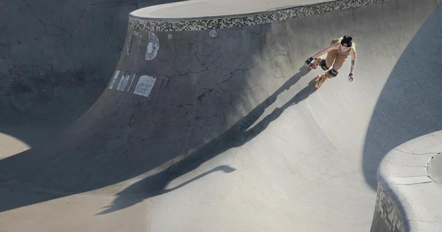 a boy riding a skate board on a cement pool