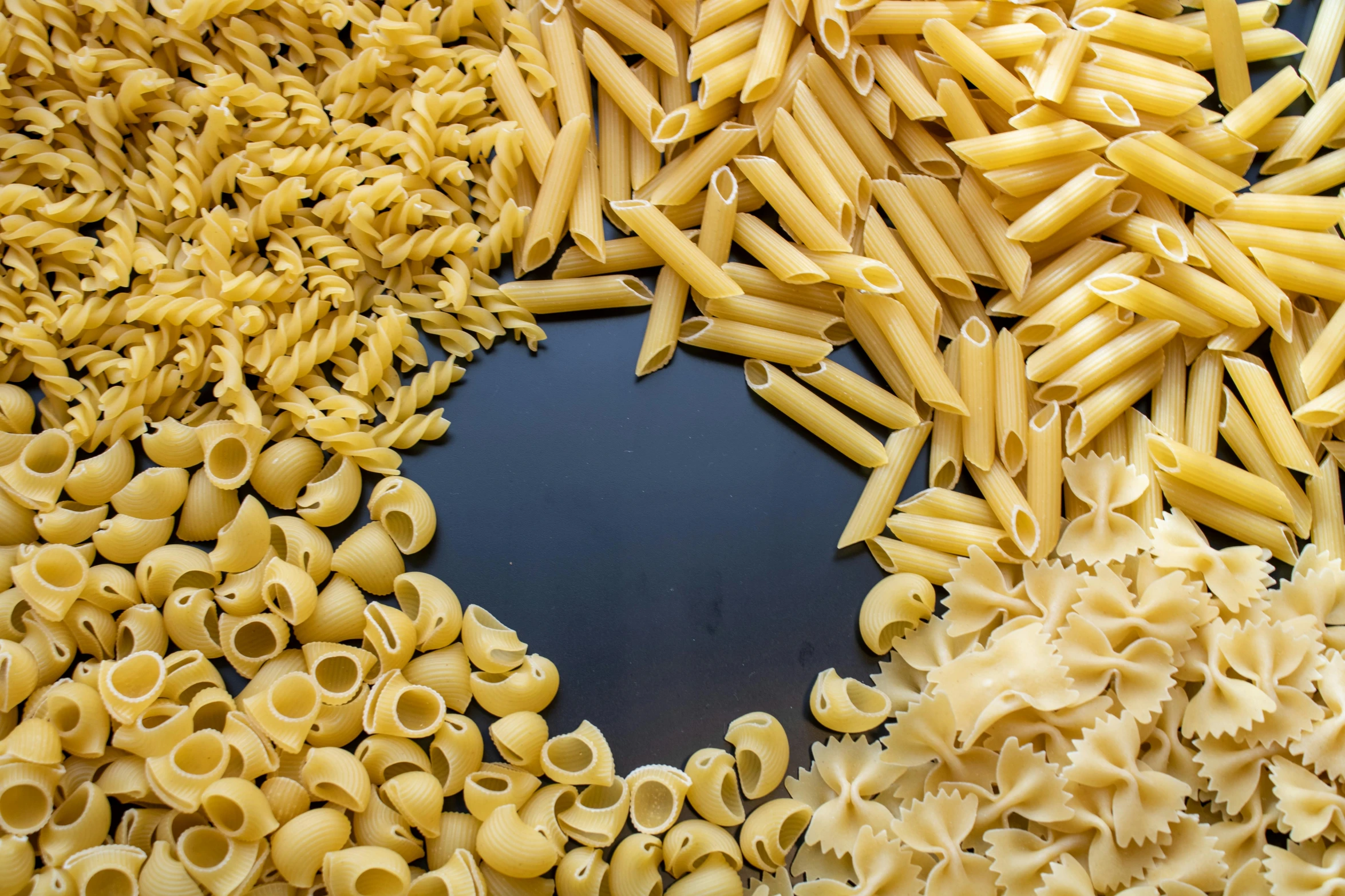 many different types of pasta are together on a platter