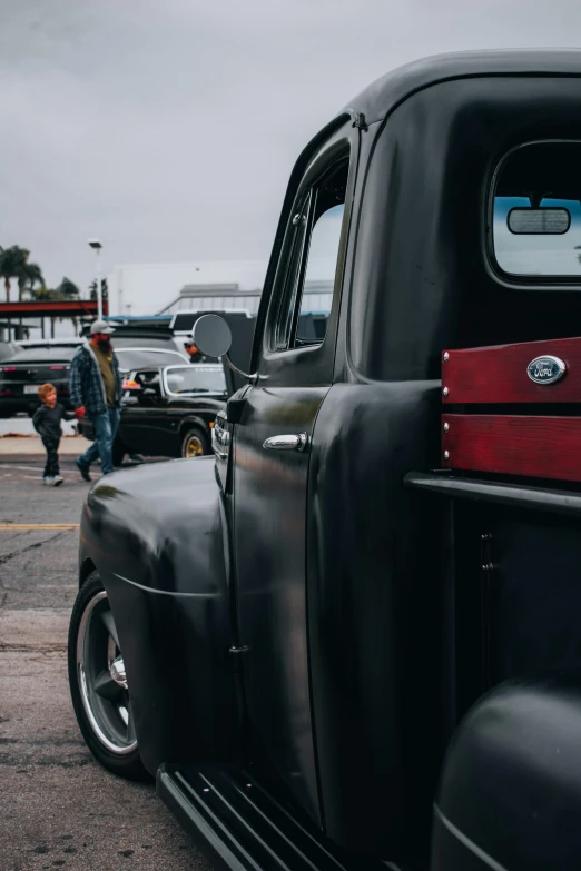 the backside of an old pickup truck sitting in a parking lot