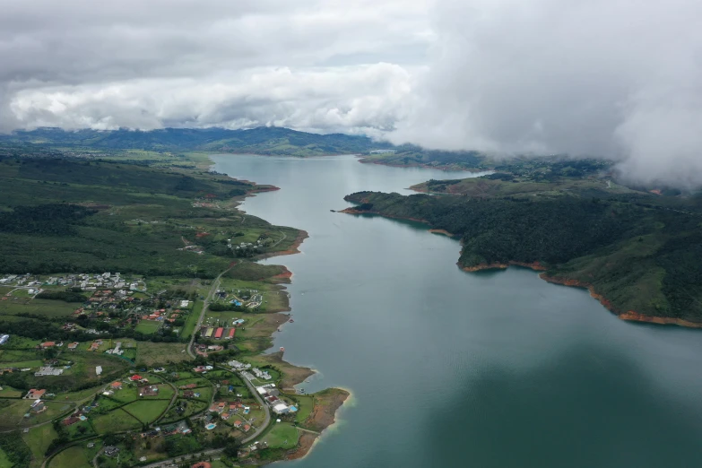 the area is covered in clouds and surrounded by green countryside